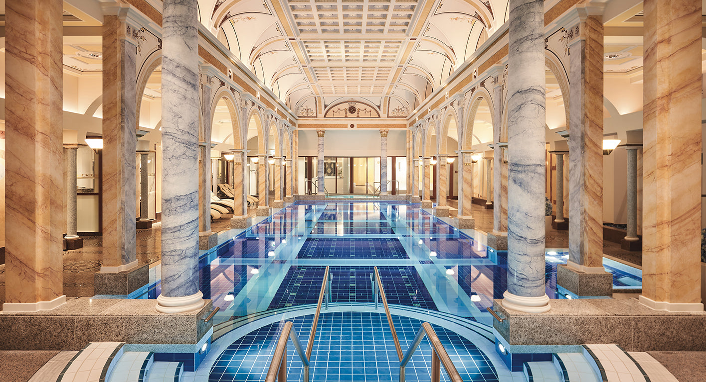 A view of a spa pool and marble pillars