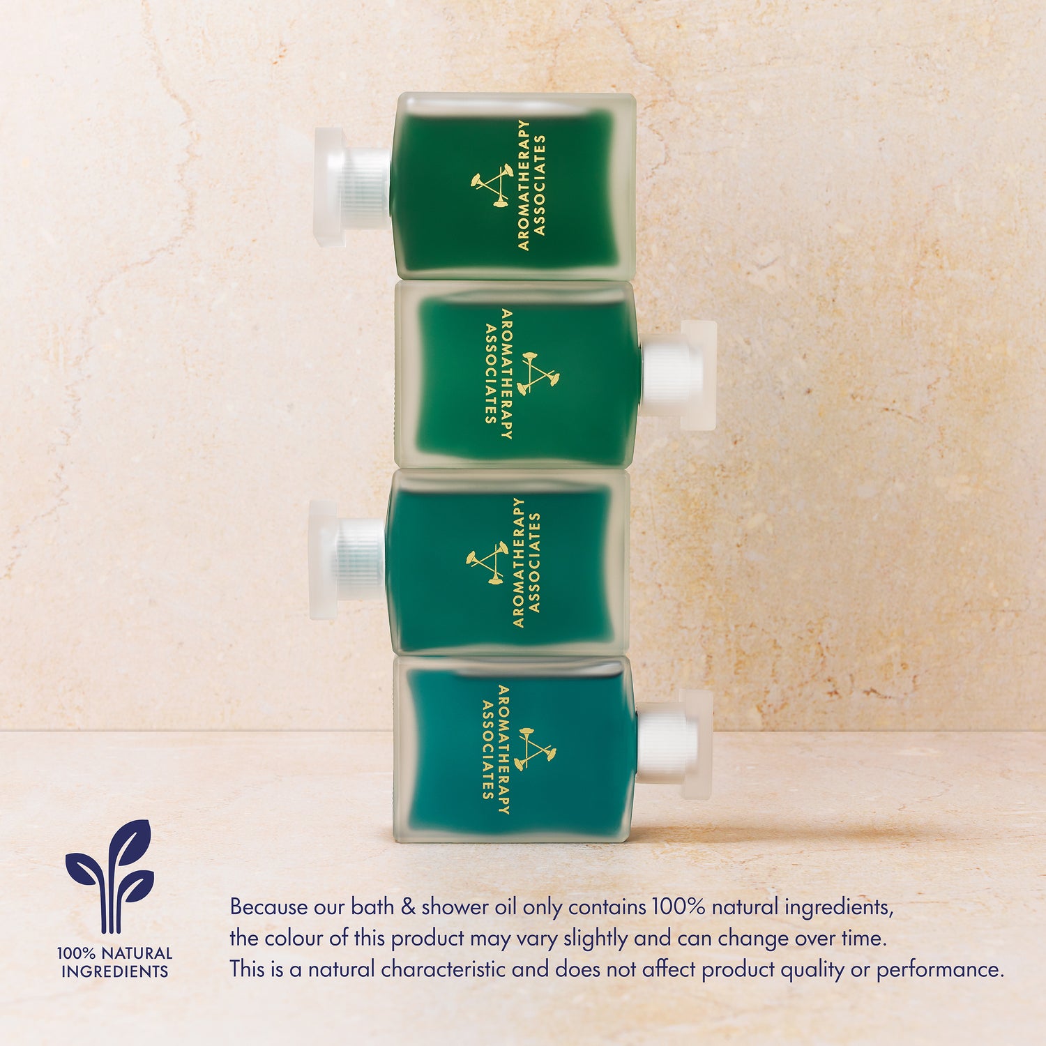 four bottles of Aromatherapy Associates bath and shower oil on a beige background