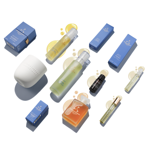 A collection of various product containers, likely to be part of a relaxation bundle, including bottles and boxes with a few being opened revealing solid or semi-solid contents.