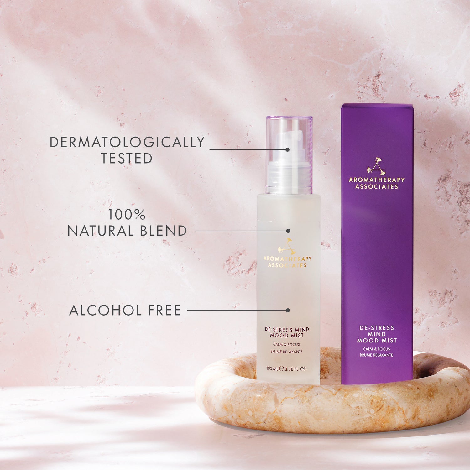 Aromatherapy Associates de-stress mood mist bottle and packaging on a pink background