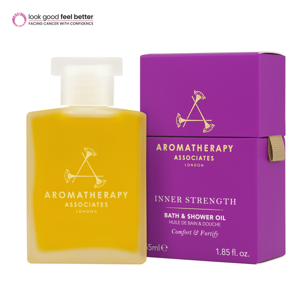 Yellow bottle and purple box of Aromatherapy Associates Inner Strength Bath & Shower Oil on a white background