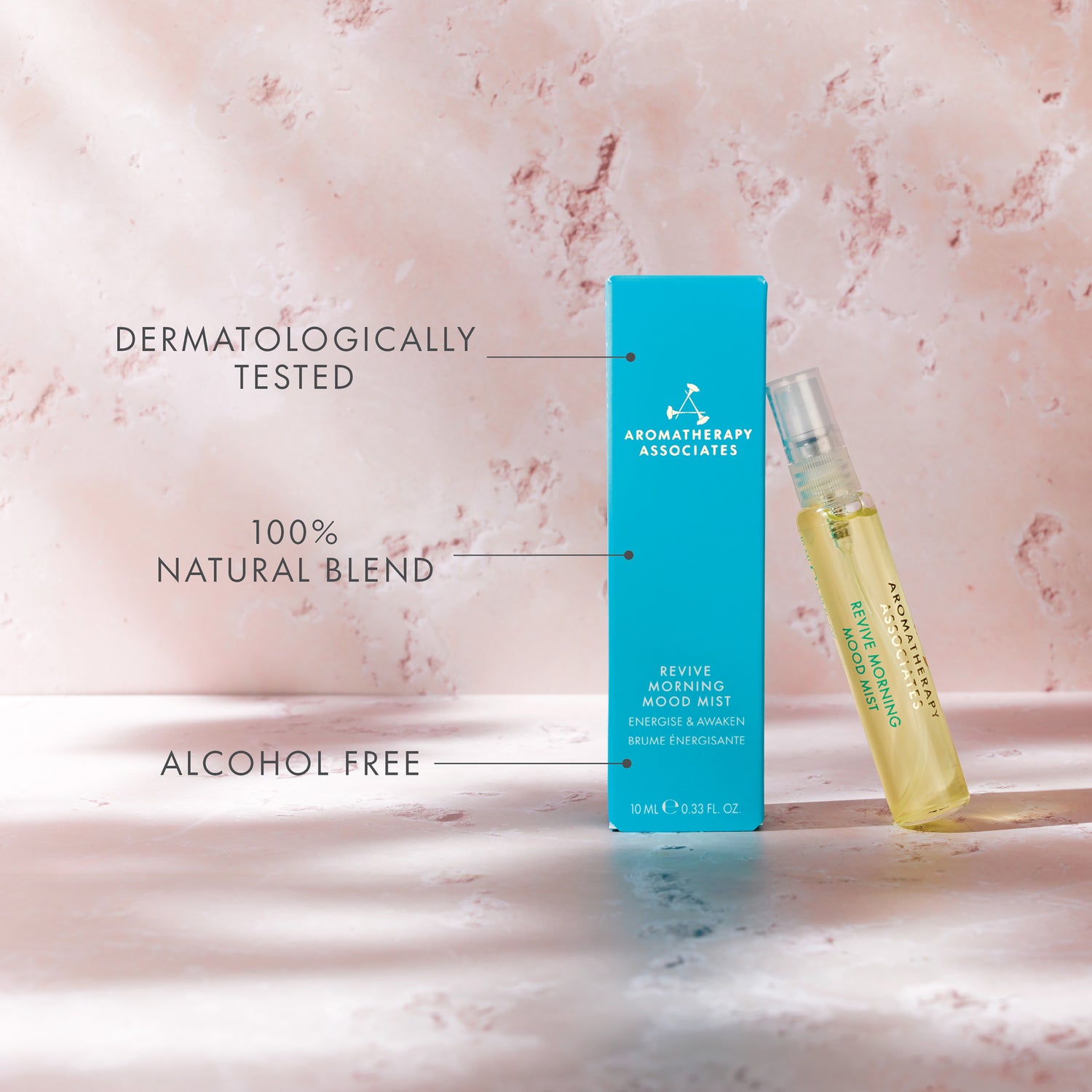 Aromatherapy Associates product with blue box and yellow bottle on a pink marble background