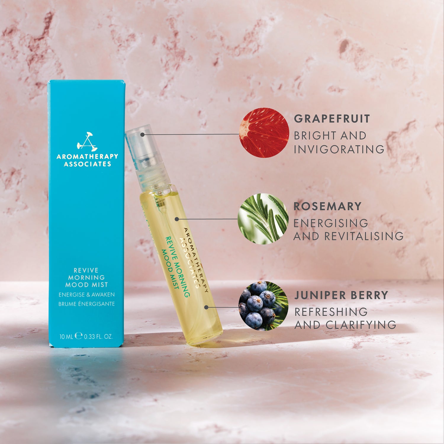 Aromatherapy Associates Revive Morning Mood Mist with packaging on a pink marble background