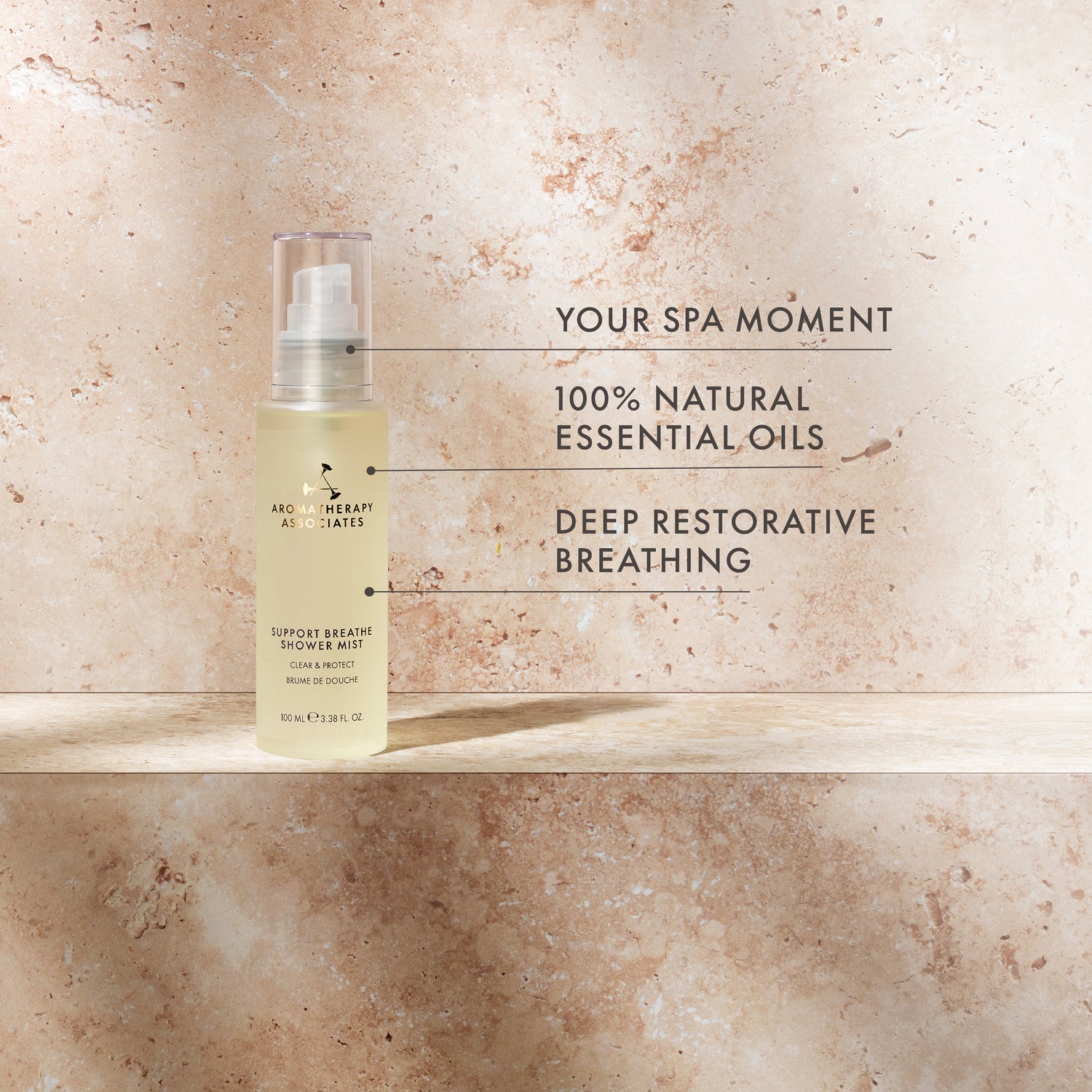 Bottle of shower mist with text on a marble background