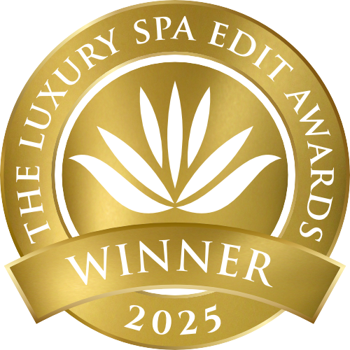 Gold emblem with 'The Luxury Spa Edit Awards Winner 2025' text and leaf design.