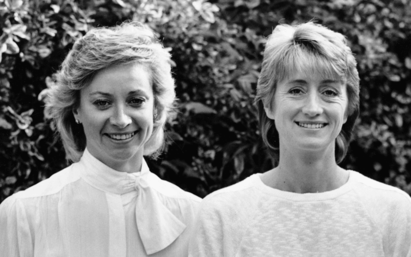 Geraldine and Sue standing side by side in a garden setting
