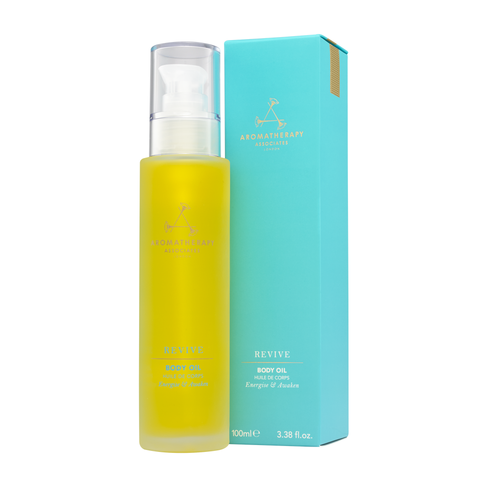 Revive Body Oil bottle with bright yellow label